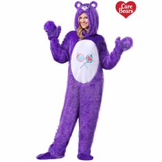 a woman in a purple bear costume standing up with her arms out and eyes closed