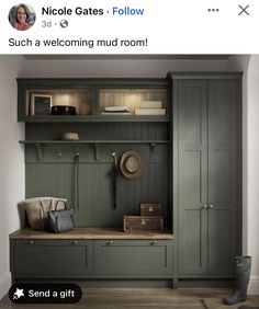 an image of a room with green cupboards and coat hooks on the wall, next to a bench