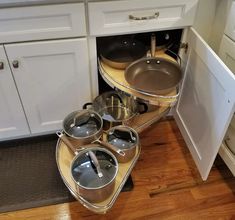 pots and pans are stacked in the corner of a kitchen