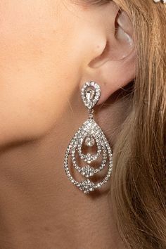 Designed with a round and full look, our AYTEN earrings will give off a fine gesture. The AYTEN Earrings are created to have a high-style look with the flowers in the middle, but with a stylish touch. This pair will sure become one of your favorites for that special event. Handcrafted Highest Quality Swarovski / Cubic Zirconia Platinum plated Guards against scratches and tarnish. approximate size 2.5" length 1" width Nickel free Free Shipping in USA Crystals Earrings, Silver Statement Earrings, Boutique Couture, Gold Statement Earrings, Full Look, Swarovski Crystal Earrings, Earrings Wedding, Wedding Jewelry Sets, Wedding Earrings