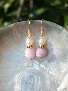 These cute dangle earrings will become a great gift for her on any occasion - for example, as graduation gift or Mother's day gift.  Made of two natural kunzite stones, freshwater pearls and gold filled beads. The ear wire are gold vermeil.  SPECIFICATIONS Length 3.5 cm Handmade in Spain Earrings come in a gift box Worldwide shipment with registered, trackable post Care for gold vermeil jewelry: avoid contact with humidity, swimming pool water and chemicals. Clean with soft dry polishing cloth. Jewelry With Matching Round Bead Earrings For Gifts, Handmade Dangle Earrings For Mother's Day, Jewelry With Matching Round Beaded Earrings For Gifts, Mother's Day Pearl Drop Jewelry Gift, Mother's Day Gift Pearl Drop Jewelry, Dainty Dangle Pearl Earrings Gift, Delicate Pearl Earrings As Gift, Adjustable Natural Stone Earrings For Gift, Mother's Day Earrings Gift For Her