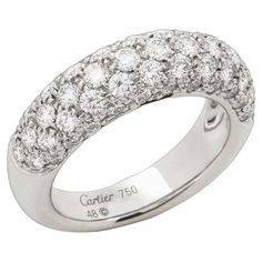 Cartier Pave Diamond 18ct White Gold Bombe Style Ring Brand- Cartier Model- Pave Bombe Style Ring Product Type- Ring Serial Number- 71**** Age- Circa 2009 Accompanied By- Cartier Box, Certificate Material(s)- 18ct White Gold Gemstone- Diamond UK Ring Size- I 1/2 EU Ring Size- 48 US Ring Size- 4 1/2 Resizing Possible- No Gemstone Quantity- 59 Gemstone Colour- est G/H Gemstone Clarity- est VS Gemstone Cut- Round Brilliant Gemstone Carat Weight- est 0.95ct Total Weight- 7g Condition Rating- Excellent Condition Notes- An item rated as excellent exhibits minimal to light signs of use. Luxury White Gold Concave Ring, Classic Cartier Diamond Ring With Pave Setting, Cartier Diamond Ring With Pave Setting For Wedding, Cartier Diamond White Brilliant Cut Diamond Ring, Classic Cartier Rings With Pave Setting, Classic Cartier Jewelry With Pave Setting, Formal Cartier Rings With Pave Setting, Cartier Rings With Pave Setting For Formal Occasions, Classic Cartier Hallmarked Rings