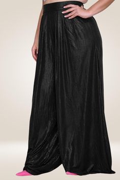 These black palazzo pants are the perfect fashion statement for a night out! Steal the spotlight in these beautiful high-waisted Palazzo Pants. They are made of a luxurious metallic fabric, a hidden zipper on the side, and feature a wide leg silhouette. These plus size palazzo pants are perfect for any occasion. Wear them to work, to a party, or to the grocery store, these pants will never let you down. The metallic finish is flattering on any skin tone and will never go out of style. team them with a matching silver crop top and heels for the total look Update your wardrobe with these black wide leg pants. Featuring a metallic material, a back hidden zipper, and a wide-leg fit, team them with a matching silver crop top and heels for the total look Metallic Shimmer Detail Wide Leg Pants Ba Elegant Metallic Bottoms For Evening, Black High Waist Maxi Skirt For Evening, Elegant Black Wide Leg Pants With Elastic Waistband, Evening High Waist Black Maxi Skirt, Elegant Stretch Floor-length Bottoms, Party Wide Leg Bottoms With Elastic Waistband, Wide Leg Bottoms With Elastic Waistband For Party, Metallic Stretch Pants For Evening, Solid Bottoms With Elastic Waistband For Party