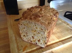 a loaf of bread sitting on top of a cutting board