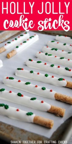 holly jolly cookie sticks on a baking sheet