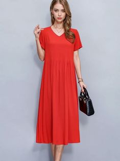 Turn heads wherever you go with this bold and elegant red A-line dress. The vibrant hue is a statement in itself, perfectly balancing boldness with timeless sophistication. Designed to flatter various body types, this dress features a relaxed fit that gently drapes over the body, offering both style and comfort. The V-neckline adds a touch of femininity, while the short sleeves ensure a casual yet polished look. One of the standout features is the inclusion of discreet side pockets, providing bo Casual Red A-line Maxi Dress, Red V-neck Maxi Dress, Red Solid Color Midi Dress For Summer, Chic Red Solid Color Midi Dress, Summer Solid Color Red Midi Dress, Red Solid Color Maxi Dress For Spring, Solid Pleated A-line Maxi Dress, Solid A-line Pleated Maxi Dress, Pleated A-line Maxi Dress