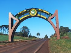 an arch on the side of a road that says central arizona begins to be dead