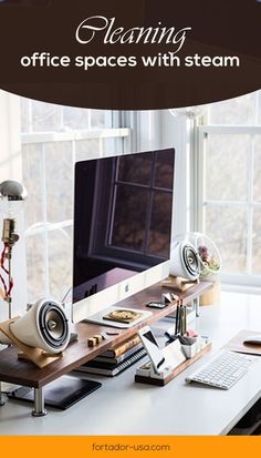 a desk with a computer on it in front of a window and the words, amazing office spaces with steam