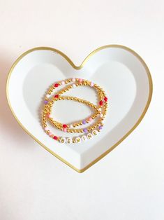 Seasonal Valentine Stacks Beaded Heart Bracelet Pre-made - Etsy Valentine's Day Gold Friendship Bracelets With Letter Beads, Gold Friendship Bracelets With Letter Beads For Valentine's Day, Dainty Beaded Bracelets With Heart Charm For Friendship, Gold Bracelets With Letter Beads For Best Friend, Heart Beads Friendship Bracelet For Valentine's Day, Heart Beads Name Bracelet For Valentine's Day, Heart Shaped Beaded Bracelet With Letter Beads As Gift, Valentine's Day Stackable Friendship Jewelry, Stackable Jewelry For Friendship On Valentine's Day