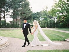 the bride and groom are walking together