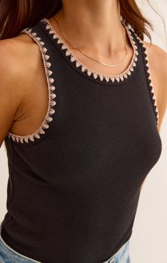 Your everyday base layer is here. Made using softly textured rib fabric, this fitted and flattering tank features contrast crochet stitching that helps it stand out from the rest. Premium Feather Rib: 95% Cotton,/5% Spandex Crew neckline Bra friendly Black Embroidered Summer Top, Ribbed Crochet, Rib Top, Crochet Tank Top, Rib Fabric, Knit Denim, Crochet Tank, Cropped Denim Jacket, Trend Forecasting