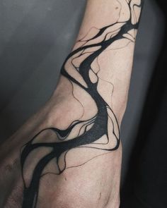 a person's arm with a tree tattoo on it