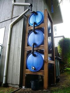 an outdoor water storage system made out of barrels