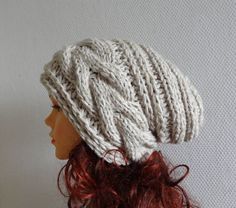 a knitted hat is shown on top of a mannequin's head