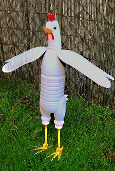 an inflatable chicken is standing on its legs