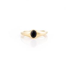 This is part of Chairish’s Fine Jewelry assortment.  Unisex Black Onyx Promise Ring in 14K Gold featuring natural onyx of 0.3 carats. The gorgeous handcrafted ring goes with every style, every occasion or any outfit.  Onyx gives energy of strong support and determination to hep one persevere.  Designed with round cut black onyx studded in center with solid gold that makes it a perfect fit to wear it on your occasion or style it with any of your basic outfit to give it a glam. This is a perfect e Minimalist Onyx Yellow Gold Jewelry, Oval Onyx Signet Ring With Gemstone, Gold Onyx Jewelry With Black Enamel, Yellow Gold Onyx Signet Ring With Black Enamel, Adjustable Black Enamel Onyx Rings, Everyday Rings, Handcrafted Rings, 3 Carat, Basic Outfits