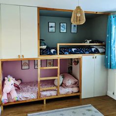 a room with bunk beds and toys in it