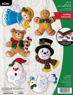 an image of christmas teddy bears and other holiday decorations on a white wooden background with green trimmings