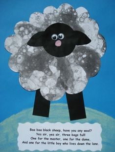 a paper cut out of a sheep with a poem written on the front and bottom