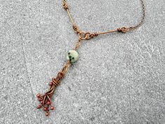 With its airy, free-spirited feel, this ocean-inspired copper necklace is the perfect accent for a boho-chic wardrobe. A delicate kiwi jasper pendant accented with handmade copper tendril echos the form of jellyfish. Without the sting, it’s all sweetness. Green Bohemian Copper Wire Necklace, Nature-inspired Necklace With Natural Stones And Copper Wire, Nature-inspired Copper Wire Necklace With Natural Stones, Kiwi Jasper, Chic Wardrobe, The Sting, Fringe Necklace, Ocean Inspired, Jasper Pendant