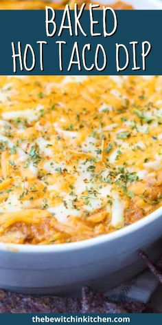 baked hot taco dip in a white casserole dish with tortilla chips