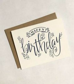 a birthday card with the words happy birthday written in cursive writing on it