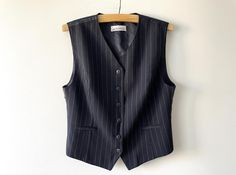 Vintage Black striped women's vest, formal wool blend waistcoat, Steampunk sleeveless blazer, office clothing, women businesslike outfit, gift for her, size large Label size: GB 16 Measurements: Length: 24.5" Pit to pit: 20" Please check measurements to insure a proper fit. Remember to allow yourself some extra room for movement. You can compare these with something from your closet that fits you well. Please convo me if you need additional measurements. Condition: Very Good vintage condition SH Outfit Large, Office Clothing, Sleeveless Blazer, Vest Outfits, Office Outfits, Western Outfits, Women's Vest, Buy Vintage, Clothing Women