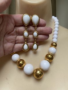 "You must have at least one set of white jewelry just for summer. White pearls don't count. I'm talking fun stuff. Necklace is signed Napier and earrings signed Trifari. Necklace will extend from 16 to 18\" with a hook clasp. Largest front beads are about 18 and 20mm round. They continue to be fairly big at about 10mm near clasp. Earrings are clip backs marked Trifari. Big look at 3\" but the largest section is against the earlobe. Not heavy anyway but I think the largest bead at top is a good i White Jewelry With Matching Earrings, White Round Jewelry With Matching Earrings, Formal White Jewelry Sets With Matching Earrings, White Dangle Costume Jewelry, Classic White Jewelry With Matching Earrings, Classic White Jewelry Set With Matching Earrings, Formal White Drop Jewelry, White Drop Jewelry For Formal Occasions, White Costume Jewelry For Jewelry Making