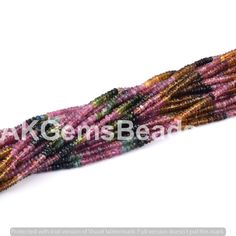 multicolored seed beads on white background