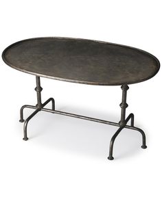 an oval metal table with two legs