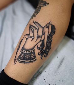 a woman's arm with a tattoo on it