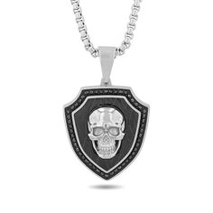 Dark yet dazzling, make a bold statement with this men's black diamond skull shield pendant. Stainless steel with black ion-plate. Shield-shapped design is outlined with black diamonds. A dimensional skull centres the design. 1/2 ct. t.w. of diamonds. 24.0-inch box chain; lobster claw clasp. Black Skull Print Jewelry For Streetwear, Black Engraved Skull Jewelry, Black Skull Shaped Engraved Jewelry, Black Skull Engraved Jewelry, Black Skull-shaped Engraved Jewelry, Black Stainless Steel Skull Necklace, Black Skull-shaped Stainless Steel Necklace, Diamond Skull, Edgy Jewelry