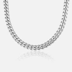 The Cuban 8mm silver chain is the essence of edgy style. A choker style chain that goes with anything, the stainless steel Cuban is the only necklace you'll ever need - but it's also the best layering piece you could want to add to your collection! Formal Silver Chain Cuban Link Necklace, Stainless Steel Cuban Link Necklace With Silver Chain, Cuban Link Silver Chain Necklace For Streetwear, Streetwear Cuban Link Silver Chain Necklace, Tarnish-resistant Cuban Link Metal Chain Necklace, Spelling And Handwriting, Choker Style, Premium Gift, Layering Pieces