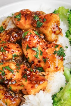 chicken and broccoli are served on top of rice in a white bowl with garnishes