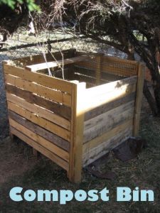 the compost bin is made out of pallet wood