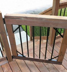 a wooden deck with metal railings on it