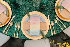 a table set with place settings and napkins