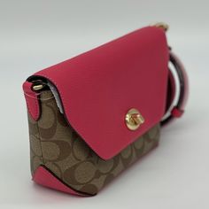 Brand New With Tag Brand New Spring Edition Coach Karlee Crossbody. This Is A Signature With Fuchsia Color. This Is A Must Have For Your Spring Wear. Msrp 298.00 And Selling Out Fast. Thank You For Looking And Please Feel Free To Check Out My Many Other Listings. Signature Coated Canvas And Refined Pebble Leather Inside Multifunction Pocket Turnlock Closure, Fabric Lining Detachable Strap With 22 1/2" Drop For Shoulder Or Crossbody Wear 8" (L) X 5 1/4" (H) X 3 1/4" (W) Luxury Pink Flap Shoulder Bag, Luxury Pink Clutch Flap Bag, Pink Satchel Flap Bag With Detachable Strap, Pink Pouch Flap Bag With Detachable Strap, Luxury Pink Flap Bag With Removable Pouch, Coach Crossbody Bag With Magnetic Closure, Pink Flap Bag With Detachable Strap For Travel, Coach Top Handle Bag With Magnetic Closure, Pink Travel Bag With Magnetic Closure