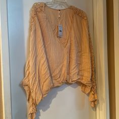 Free People Super Cute Boho Crochet Runaway Top. Features A Lined Surplice V-Neck, Crochet Lace Insets, Dolman Sleeves, And An Elasticized Waist. Cropped, Relaxed Fit. New With Tags Size: Large Ob562892 Color: Light Peach Fabric: Rayon + Modal Fall Crochet V-neck Top With Crochet Trim, Open Knit V-neck Crochet Top For Day Out, V-neck Open Knit Crochet Top For Day Out, Bohemian V-neck Lace Top For Vacation, Spring V-neck Crochet Top With Open Knit, Bohemian V-neck Crochet Top For Fall, Bohemian Crochet V-neck Top For Fall, Fall Bohemian V-neck Crochet Top, Bohemian V-neck Lace Top For Day Out