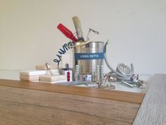 an assortment of toothbrushes and other household hygiene items on a counter top,