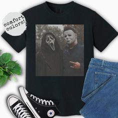 a pair of shoes and a t - shirt with the image of two people wearing masks