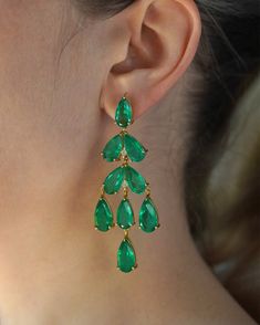 Introducing our exquisite Emerald Palace Earrings, adorned with large, captivating emerald quartz gemstones that gracefully cascade like translucent droplets, exuding an aura of refined elegance and enchantment. Style tip: Elevate your wardrobe effortlessly from day to night by adorning these divine earrings with a casual ensemble like a crisp white linen blouse and tailored trousers, infusing a touch of ethereal allure, or pair them with a sleek black evening gown for an opulent affair, emanating timeless sophistication. Indulge in the allure of enchanting elegance--immerse yourself in the delicate beauty of these beautiful earrings and embrace a world of transformative style and effortless refinement. Luxury Gemstone Earrings With Rectangular Stone, Elegant Green Gemstone Chandelier Earrings, Green Gemstone Dangle Chandelier Earrings, Green Emerald Dangle Chandelier Earrings, Elegant Green Emerald Chandelier Earrings, Green Dangle Chandelier Earrings For Formal Occasions, Green Dangle Chandelier Earrings For Formal Events, Glamorous Green Dangle Chandelier Earrings, Green Drop Crystal Earrings For Party