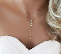 "THE WEDDING CZ LARIAT Gold, Silver or Rose gold lariat necklace for your wedding. This elegant lariat necklace is perfect for that special occasion. Features three CZs connected together and one single CZ pendant at the bottom. IT'S IN THE DETAILS ✦ 14K Gold Filled, Rose Gold or Sterling Silver Chain, clasp and rings ✦ Plated over brass (3) CZ Connectors (6mm) ✦ CZ Charm plated over brass (5mm) ✦ Necklace is shown at 17\" with a 3\" drop ✦ Optional Earrings Available in Gold, Silver or Rose Gol Rose Gold Lariat Necklace, Necklace Prom, Prom Necklace, Matric Dance, Prom Necklaces, Jewelry Rose Gold, Gold Lariat Necklace, Bridesmaid Thank You, Fake Diamond