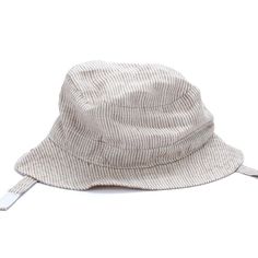 Perfect for those outdoor adventures, our vintage-style linen hat will stay secure and comfy thanks to the velcro chin strap feature. Little explorers will look adorable and stay safe. Size: S (1-2Y) w/ Chin Strap Size: M (2-6Y) w/ Chin Strap 60% Linen 40% Cotton Velcro Closure Hand Wash Only; Hang Dry Beige Adjustable Sun Hat For Outdoor, Adjustable Beige Sun Hat For Outdoor, Adjustable Fit Beige Sun Hat For Travel, Adjustable Beige Sun Hat For Travel, Adjustable Brimmed Sun Hat For Adventure, Adjustable Bucket Hat For Adventure, Summer Adventure Hat With Curved Brim, Curved Brim Summer Adventure Hat, Curved Brim Hat For Summer Adventure