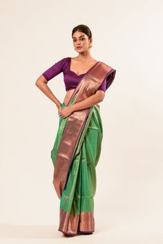 Explore our exquisite Pure Kanjivaram Silk Saree featuring a stunning dual shade of green and Maroon, adorned with intricate Zaris woven designs. Perfect for saree enthusiasts seeking timeless elegance. Green Paithani Silk Pre-draped Saree With Self Design, Green Banarasi Silk Blouse Piece For Designer Wear, Green Tussar Silk Traditional Wear With Cutdana, Green Tussar Silk Traditional Wear, Green Art Silk Traditional Wear With Cutdana, Green Silk Lehenga With Self Design, Elegant Green Banarasi Silk Blouse Piece, Green Tissue Silk Lehenga With Zari Weaving, Elegant Green Banarasi Silk Lehenga