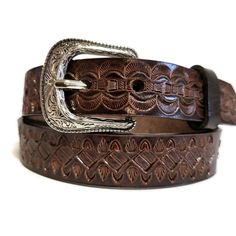 Check out this cool find! A genuine leather belt perfect for kids, crafted to pair seamlessly with all types of jeans. Not just any belt, this one's HANDMADE from top-notch leather and features an awesome hand-tooled design that's sure to stand out. Plus, it's got snaps for quick buckle swaps. Talk about handy!" Width:    1 inch Mod.14 Unsure what belt size is your little one? Please let me know what is his waist measurement. This belt is in stock and ready to be shipped! No shipping to PO Boxes Rustic Hand Tooled Adjustable Belts, Brown Hand Tooled Adjustable Belts And Suspenders, Adjustable Hand Tooled Brown Belt, Adjustable Hand-tooled Brown Belt, Rustic Hand Tooled Adjustable Belt Buckles, Rustic Brown Hand-tooled Belt, Rustic Brown Hand Tooled Belt, Artisan Belts With Concho And Adjustable Fit, Artisan Adjustable Belts With Concho