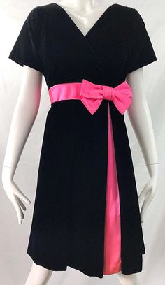 For Sale on 1stDibs - Gorgeous 1950s demi couture black velvet and hot pink silk fit n' flare dress ! Features a tailored bodice with a full skirt. Hot pink bow detail at left 1950s Silk Dress, Pink Silk Retro Dress, Pink 1950s Vintage Dress, Pink 1950s Evening Dress, 1950s Pink Vintage Dress With Short Sleeves, Raw Silk Dress, Silk Sheath Dress, 1950s Outfits, Cherry Dress