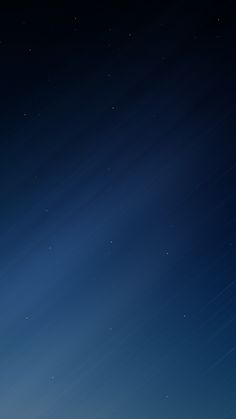 the night sky is lit up with stars and light streaks in the dark blue background