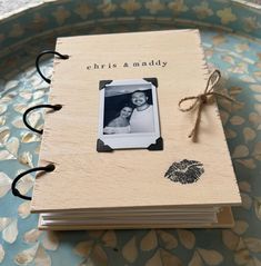 a wooden photo album with an image on it