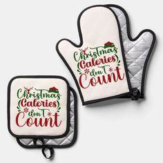 two oven mitts with christmas sayings on them